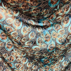 Peacock design New print in stock  Teal blue/Gold print on great quality of nylon spandex 4-way stretch 58/60”