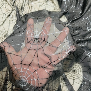 Spiderweb design metallic print on great quality of nylon power mesh 4-way stretch 58/60” Sold by the YD. Ships Worldwide from Los Angeles