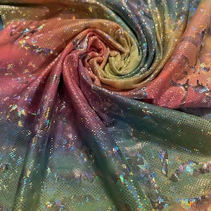 New abstract design hologram metallic poly spandex Rainbow multi pastel colors 2-way stretch 58/60” Sold by the YD.
