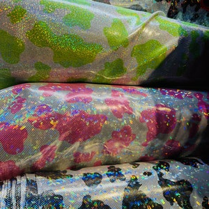 Cow Exotic design on metallic hologram nylon spandex 4-way stretch 58/60”