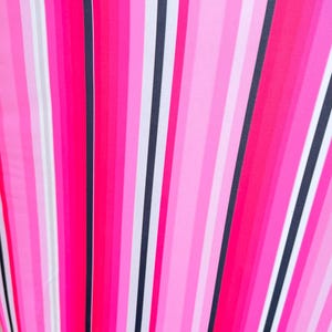 May include: A white ceramic mug with a black handle and the text "But First, Coffee" in a black, handwritten-style font. The mug is on a white surface.