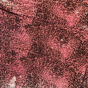 New Exotic Leopard design Mauve/Black print on great quality of stretch velvet 4-way stretch 58/60” Sold by the YD.