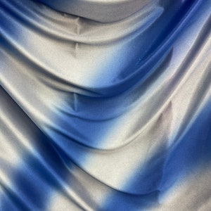 Tie dye diagonal design Sapphire/silver poliéster fabric with glitter  2-way stretch 58/60” Sold by the YD. Ships worldwide
