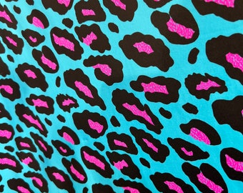 New Exotic Leopard design Turquoise/Pink it glows in the dark with black light 4-way stretch 58/60” Sold by the YD. Ships Worldwide from L.A
