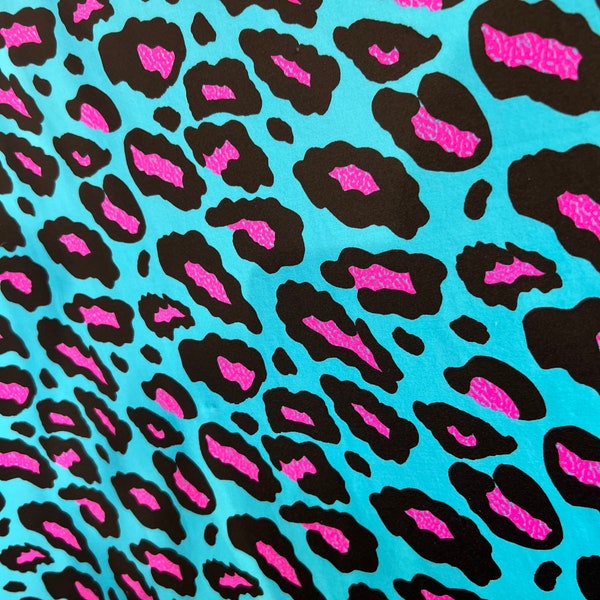 New Exotic Leopard design Turquoise/Pink it glows in the dark with black light 4-way stretch 58/60” Sold by the YD. Ships Worldwide from L.A