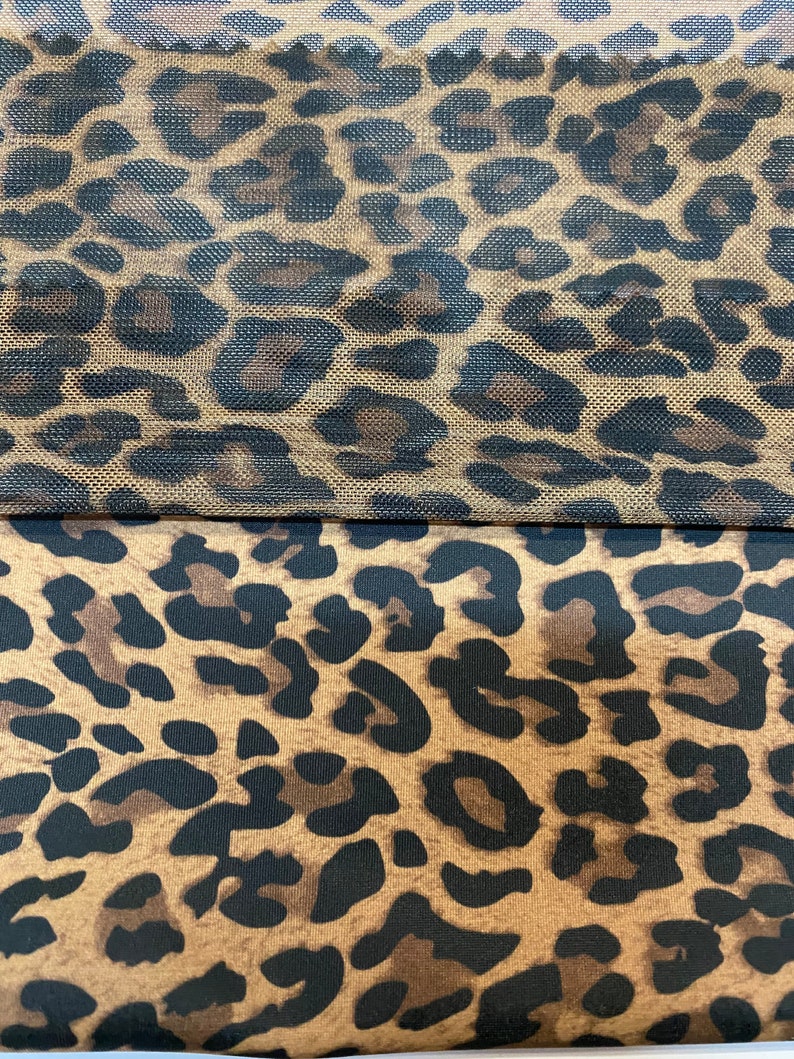 May include: Two pieces of fabric with a leopard print pattern. The top piece is a sheer mesh fabric and the bottom piece is a solid fabric.