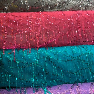 Hanging sequins all over on stretch mesh 2way 55/57&quot; Sold by the YD. Ships worldwide from Los Angeles California USA.