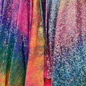 New Rainbow hologram metallic nylon spandex 4-way stretch rainbow fireworks and rainbow reptile snake hologram foil 58/60” Sold by the YD.
