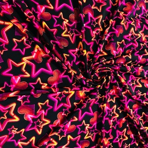 Stars design Black/Pink/Orange luxury design it glows in the dark with black light 4-way stretch nylon spandex 58/60” Sold by the YD.