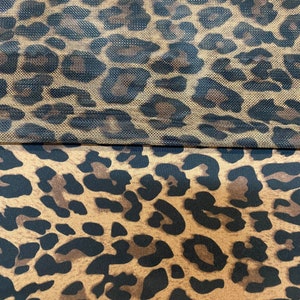May include: Two pieces of fabric with a leopard print pattern. The top piece is a sheer mesh fabric and the bottom piece is a solid fabric.