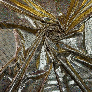 Hologram foggy foil with hologram mini sequins all over super shiny Metallic nylon spandex 4-way stretch 58/60” Sold by the YD.