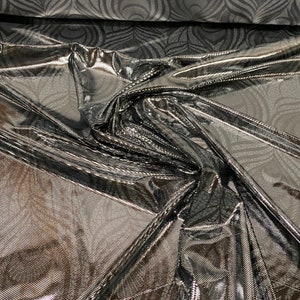 Peacock feathers design hologram metallic nylon spandex 4-way Stretch 58/60” Sold by the YD. Ships worldwide from Los Angeles California USA
