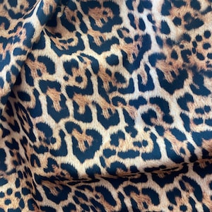 New leopard design print on nylon spandex 4-way stretch 58/60” Sold by the YD. Ships worldwide from Los Angeles California USA.
