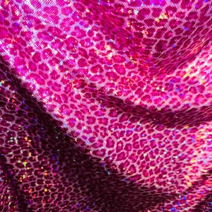 Wild Cheetah design on shattered glass hologram metallic nylon spandex 4-way stretch 58/60” Sold by the YD