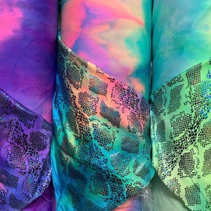 Anaconda design exotic snake skin holothin foil best quality of metallic nylon spandex 4-way stretch 58/60” Sold by the YD. Ships Worldwide