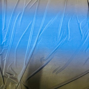 New ombré shiny poly spandex sapphire/black 2-way stretch light weight spandex 58/60” Sold by the YD. Ships Worldwide from Los Angeles CA
