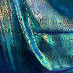 New tie dye iridescent foil crocodile design blue/green 4 way stretch 58/60&quot; Sold by the YD. Ships worldwide from Los Ángeles California USA