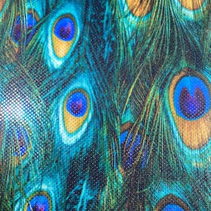 New peacock design reaction print on great quality of nylon spandex with clear foil dots 4-way stretch 58/60” Sold by the YD.