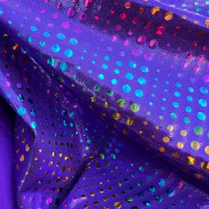 New Iridescent disco design Hologram purple on metallic Nylon spandex 4-way stretch 58/60” Sold by the YD. Ships Worldwide from Los Ángeles