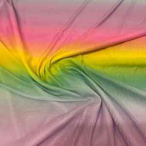 New rainbow design power mesh 4-way stretch nylon quality 58/60” Sold by the YD. Ships worldwide from Los Angeles California USA.