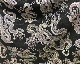New Exotic Dragon design print on metallic power mesh nylon spandex 4-way stretch 58/60” Sold by the YD. Ships worldwide