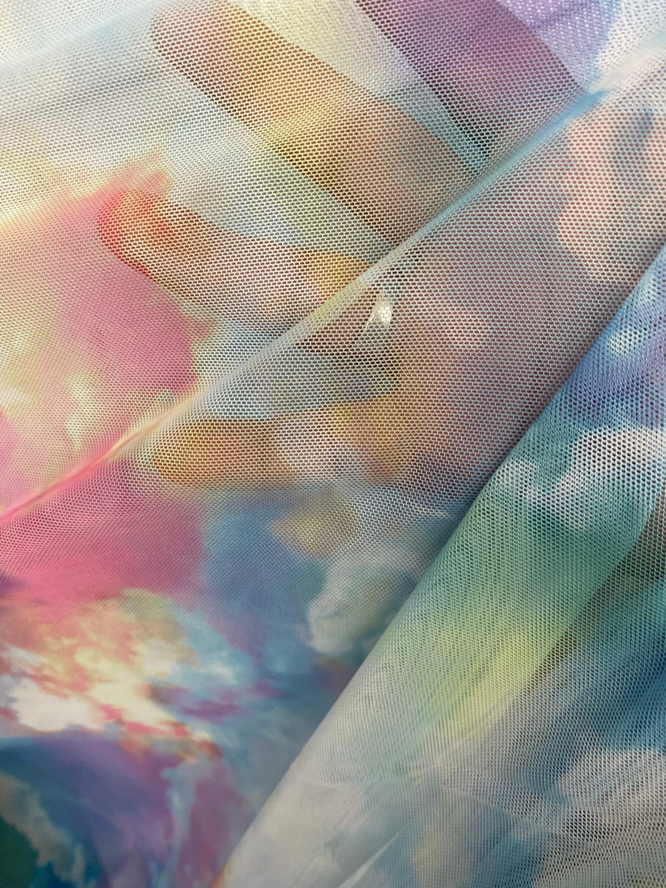 New celestial clouds design print on power mesh 4-way stretch 58/60” Sold by the YD. Ships worldwide from Los Angeles California USA.
