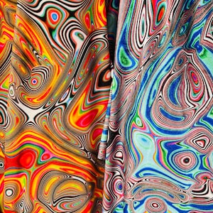 May include: Close-up of two fabric panels with a vibrant, swirling pattern. The designs feature a mix of colors including red, yellow, blue, green, and black, creating a psychedelic effect. The fabric appears to be soft and flowing.