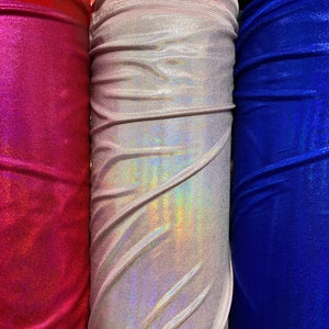 Iridescent foggy foil Hologram metallic nylon spandex 4-way stretch 58/60” Sold by the YD. Ships worldwide from Los Ángeles CA USA.