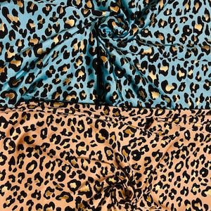 New exotic metallic leopard design nylon spandex 4-way stretch it glows in the dark 58/60” Sold by the YD. Ships worldwide from Los Angeles