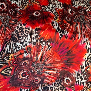 Hiding Leopard & Peacock design exotic animal print on yoga poly spandex 4-way stretch 58/60” Sold by the YD. Ships Worldwide