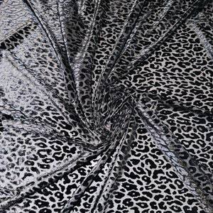New Exotic cheetah design luxury black burnout stretch velvet 4-way stretch 58/60” Sold by the YD. High quality fabric In the market.