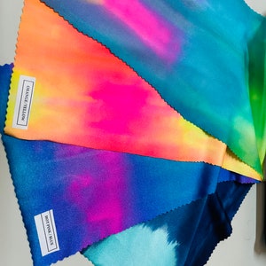 May include: Five fabric swatches in different tie-dye patterns. The swatches are labeled "Navy Green", "Hot Pink/Blue", "Orange Yellow", and "Molly Pastel".
