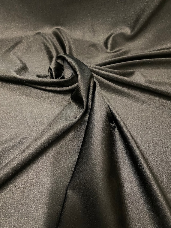 Lizard jumbo embossed great quality of nylon spandex 4-way stretch 58/60” Sold by the YD. Ships worldwide from Los Angeles California USA.