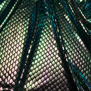Iridescent green mermaid fish scale design. Spandex Fabric 4way. Sold by the yd.  60&quot; inches