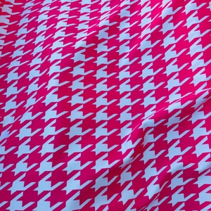 Houndstooth design Hot pink/White print on great quality of nylon spandex  4-way stretch 58/60” Sold by the YD. Ships worldwide from L.A CA