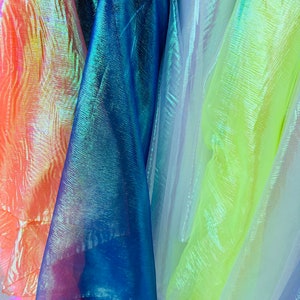 New Iridescent high quality of organza two tone rainbow non stretch 55/57” Sold by the YD. Ships worldwide from Los Angeles California USA