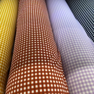 Gingham design 1/4” squares printed in best quality of nylon spandex 4-way stretch 58/60” Sold by the YD. Ships Worldwide from Los Angeles