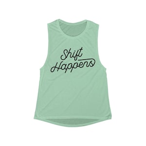 May include: A light green sleeveless muscle tank top with the text "Shift Happens" in black script.
