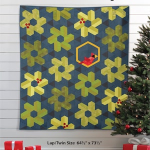May include: A blue quilt with a floral pattern in shades of green and yellow, with a red cardinal in a yellow hexagon. The quilt is 164 x 187 cm. The words "Winter Visit" are at the top.