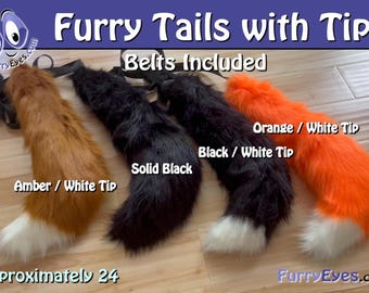 May include: Four faux fur tails with black belts included. The colours are amber with a white tip, solid black, black with a white tip, and orange with a white tip. The text reads Furry Tails with Tips, Belts Included, and Approximately 24 inches.