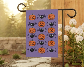May include: Purple Halloween garden flag with a repeating pattern of orange pumpkins with black eyes and a black spider with eight legs.