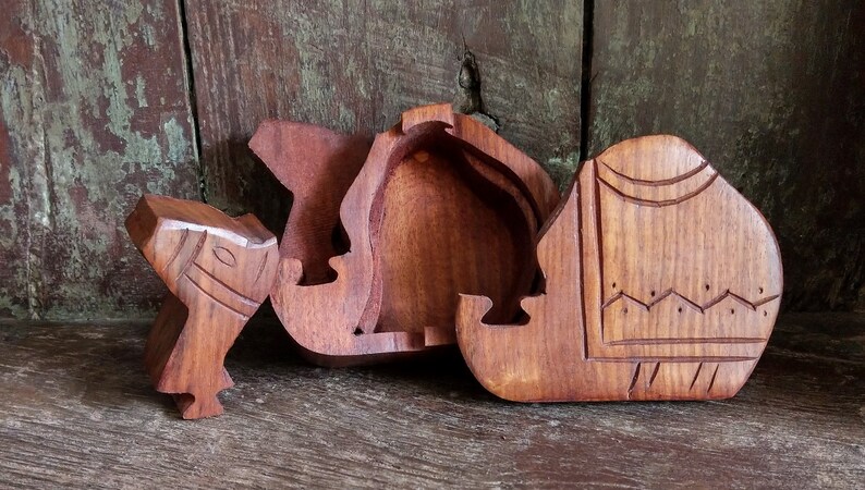 treasure box in shape of a cat or camel Carved wooden cat or camel figurine puzzle box