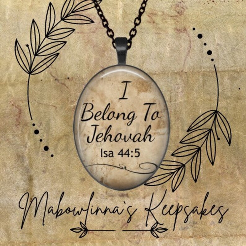 May include: An oval pendant necklace with the text "I Belong To Jehovah Isa 44:5" in black lettering. The pendant hangs from a black chain. The background is a textured, sepia-toned design with decorative leaf accents and the text "Mabowfinna's Keepsakes".