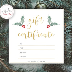 May include: A white gift certificate with a gold border and the words "gift certificate" in gold script. The certificate is decorated with two watercolor holly sprigs with red berries. The text "To", "From", "Amount", and "Expires" are printed on the certificate, along with a line for each to fill in the information.