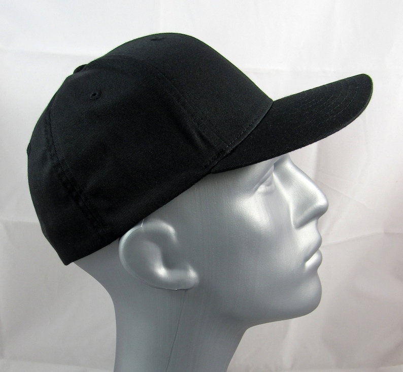 May include: A black baseball cap with a curved brim. The cap is made of a soft, cotton fabric.