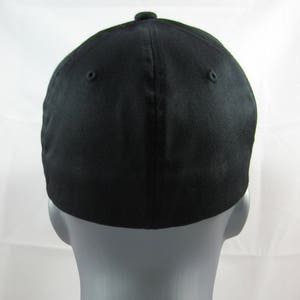 May include: A black baseball cap with a curved brim. The cap is made of a soft, comfortable fabric.