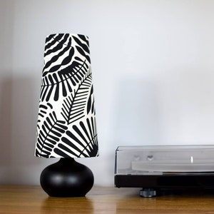 Conical / cone lampshade with table lamp base option, monochrome botanical black and white tropical leaf pattern, handmade by vivid shades.