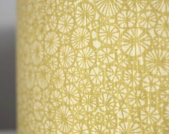 Scandinavian mustard fabric lampshade handmade by vivid shades, funky retro pinwheel pattern drum yellow scandi abstract