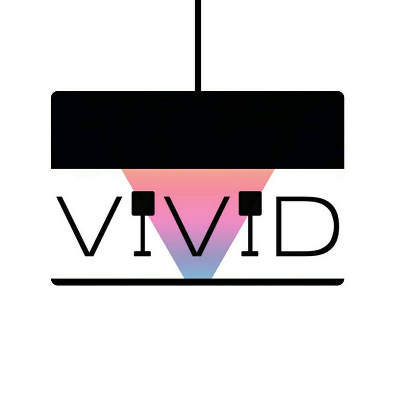 May include: A black and white logo with the word "VIVID" in bold letters. The "I"s are highlighted with a pink, blue, and purple gradient triangle.