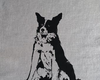 May include: Black and white silhouette of a border collie dog sitting on a gray linen background.